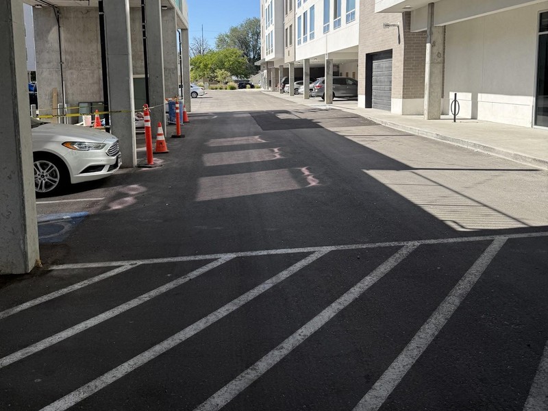 Fresh asphalt and new striping at a multifamily property