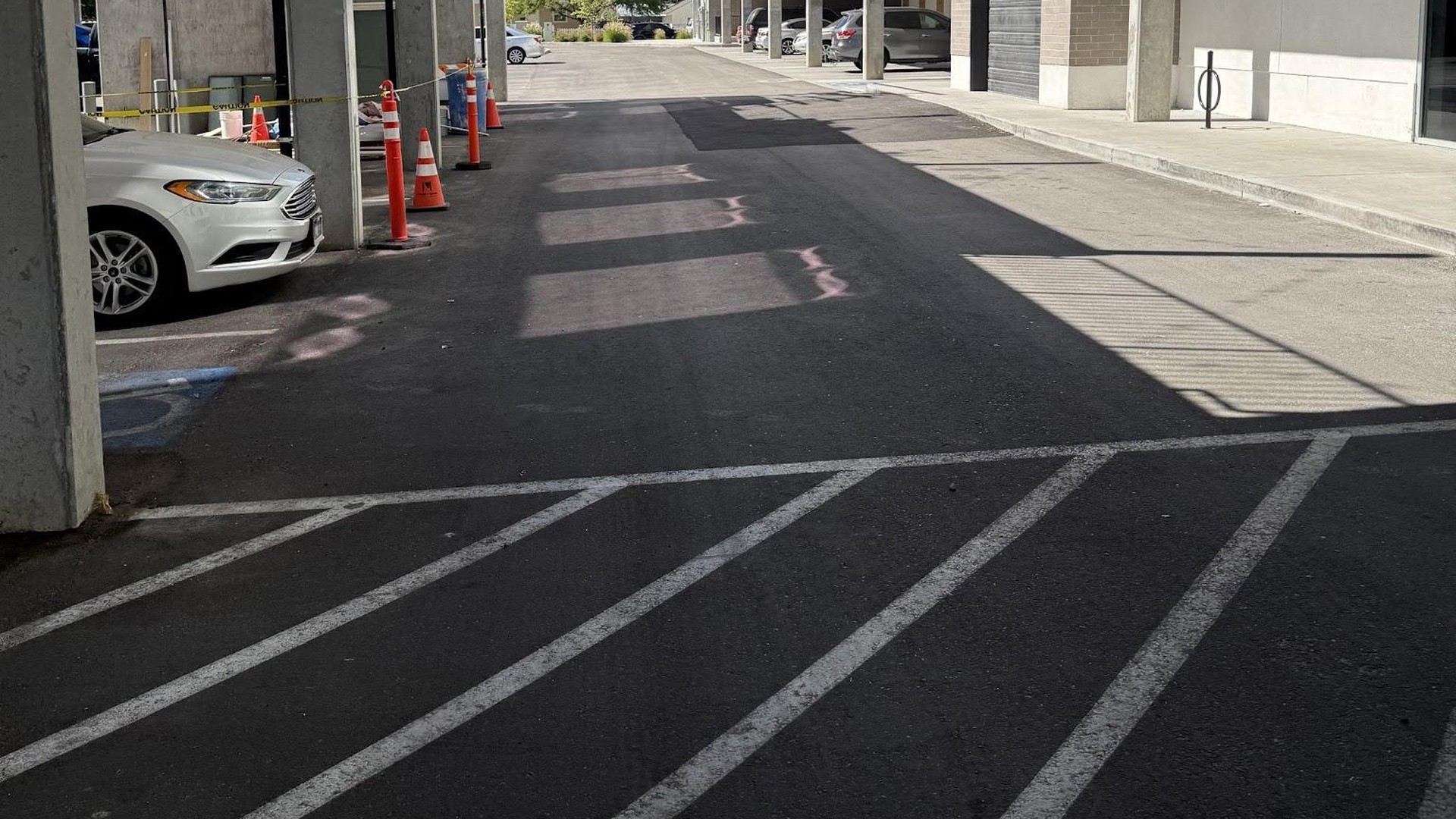 Fresh asphalt and new striping at a multifamily property
