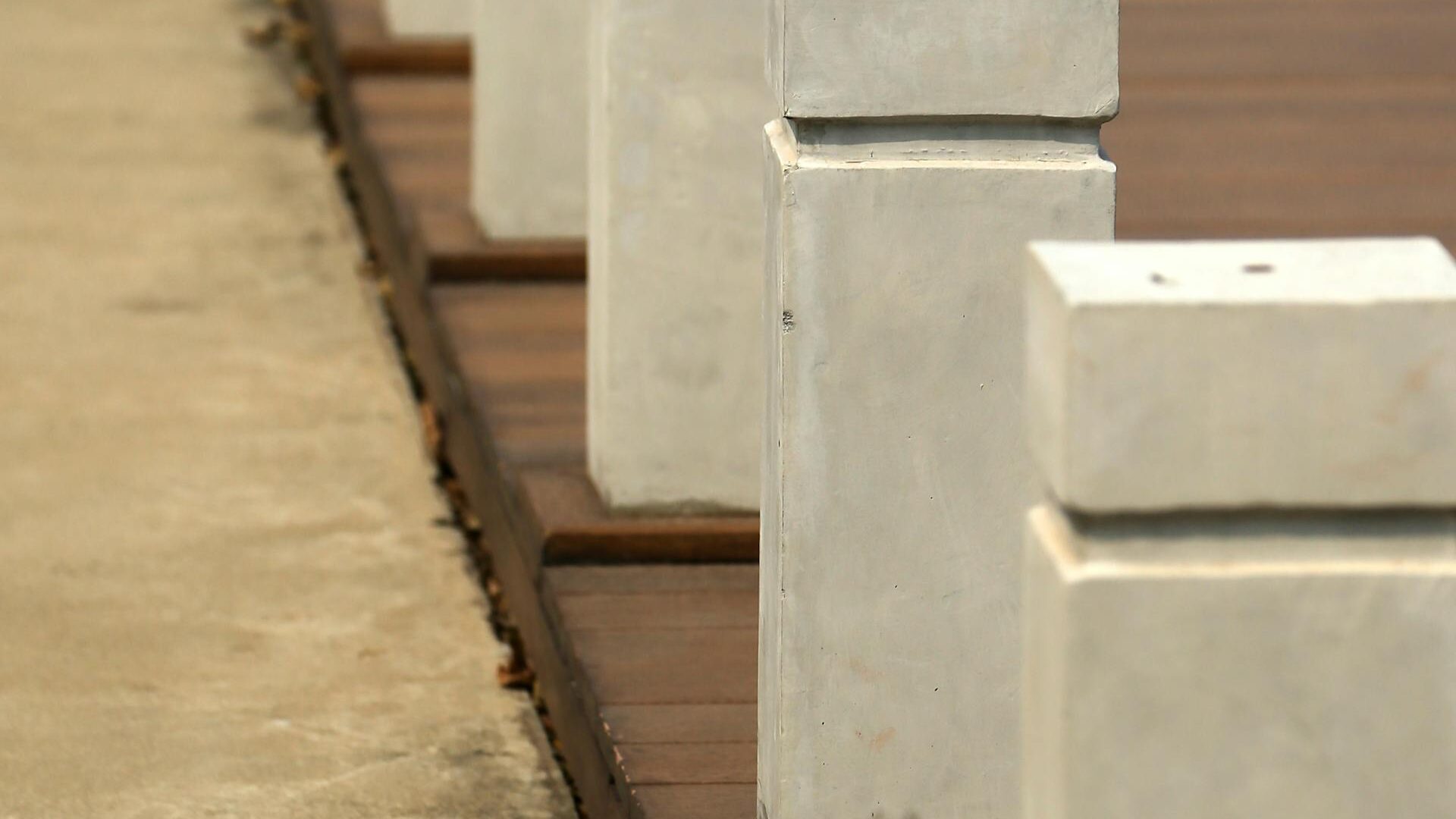 Concrete bollards serving as a pedestrian safety barrier