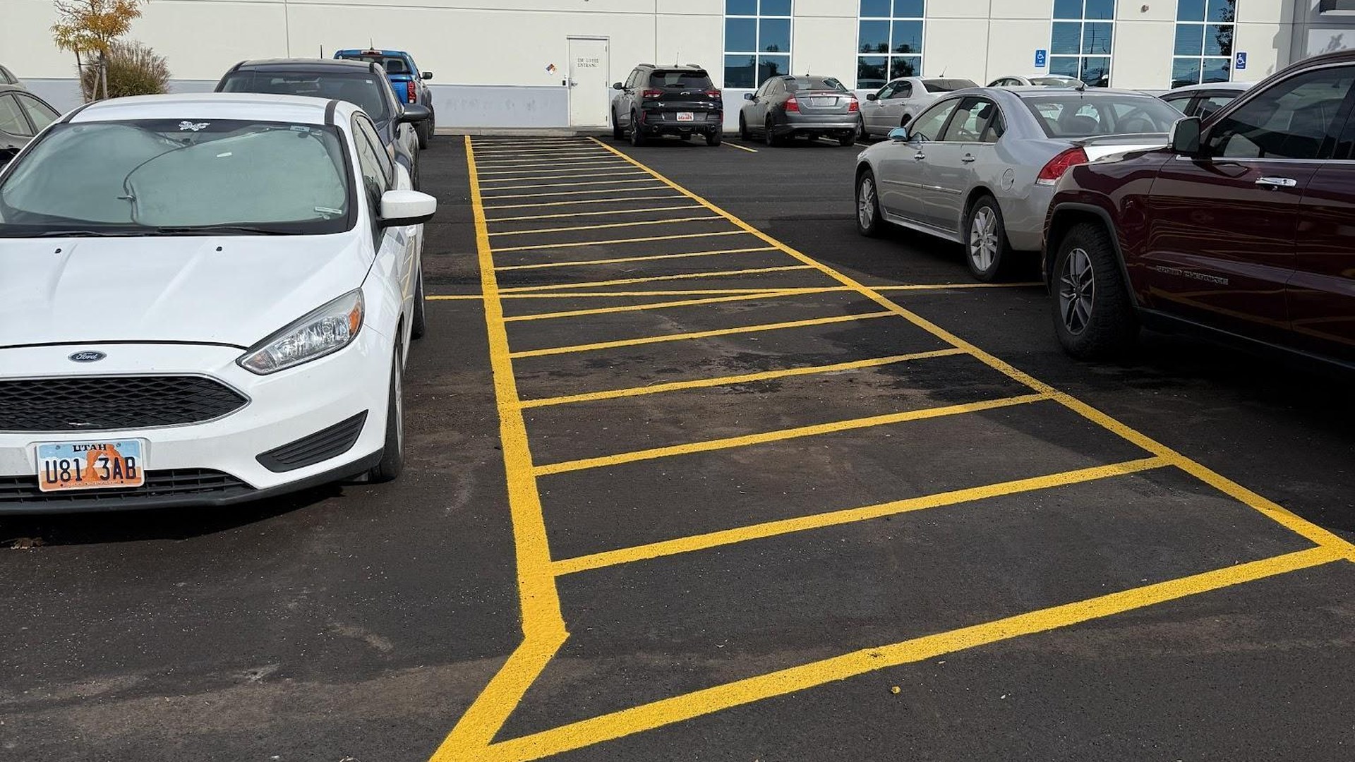 Fresh parking lot striping at a commercial warehouse property